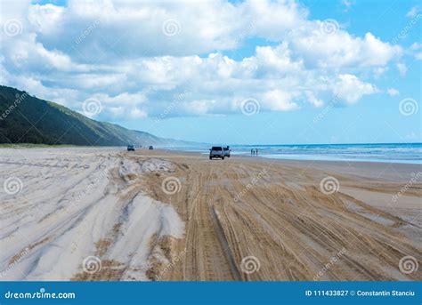 4wd Vehicles at Rainbow Beach with Coloured Sand Dunes, QLD, Australia ...