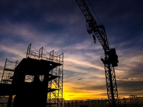 Premium Photo Low Angle View Of Silhouette Cranes Against Sky