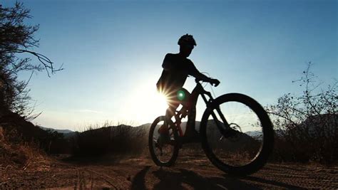 Slow Motion Silhouette Man Mountain Biking Stock Footage Video 100