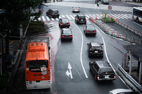 Premium Photo | People driving cars on the city street