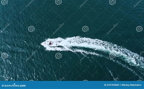 Aerial View Of A Speedboat Moving In A Circle For A Turn With A Man