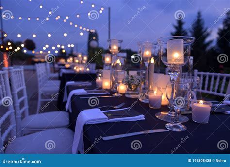 Dinner Table With Candles At A Wedding By Night Stock Photo Image Of