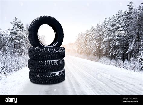 Winter Tires On A Snowy Road Seasonal Tire Change Stock Photo Alamy