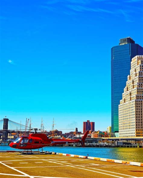 Premium Photo | Helicopter landing at helipad. skyline with skyscrapers ...