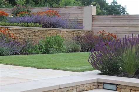 Modern Terraced Garden With Level Lawns And Colourful Planting