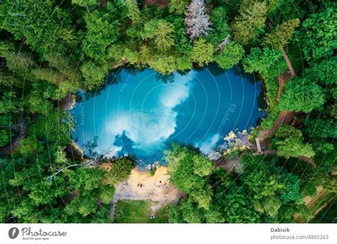 Aerial View Of Blue Colored Forest Lake In Poland A Royalty Free