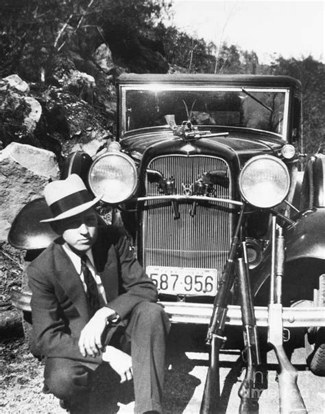 Clyde Barrow With Guns And Automobile By Bettmann