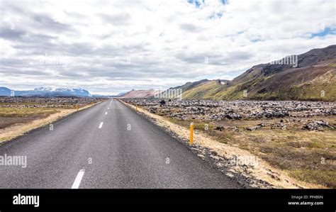 Typical Icelandic Landscape With Asphalt Road Colorful Evening Scene