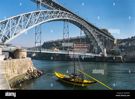 Traditional Rabelo Boats For Port Wine On The River Douro Waterfront In