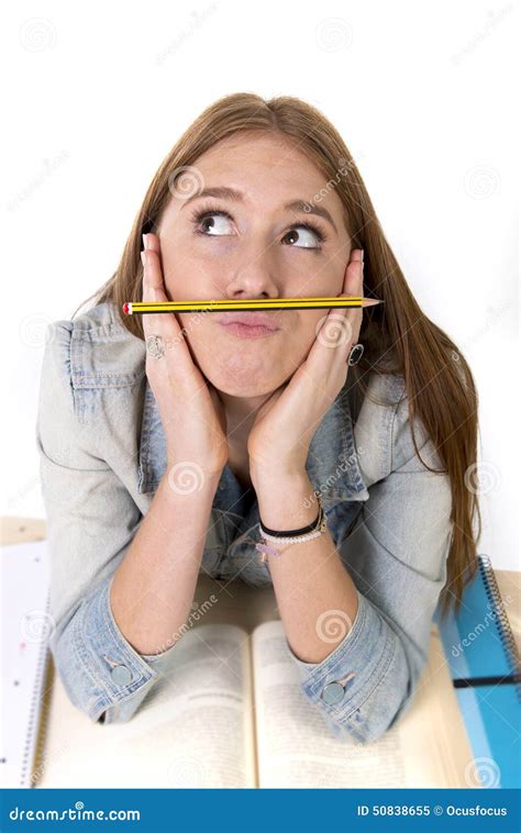 Young Beautiful Student Holding Pen Between Nose And Lips As Mustache