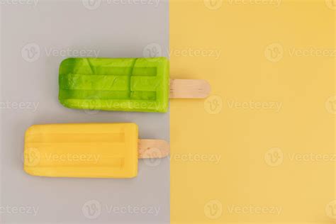 Ice cream stick on gray and yellow background. 11092501 Stock Photo at ...