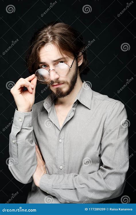 Young Man Wearing Eyeglasses Over Black Background Lifestyle Concept