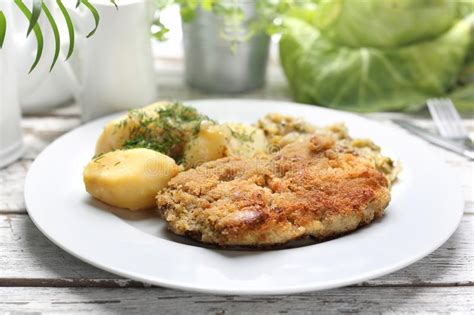 Traditional Pork Chop With Potatoes And Fried Cabbage Stock Photo