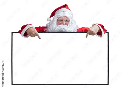 Santa Claus Is Holding And Pointing The White Blank Sign For Seasonal