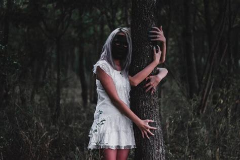 Premium Photo Women Hugging Trees In Forest