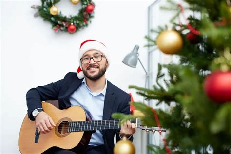 Top 30 Easy Guitar Christmas Songs with Chords - On Point Guitar