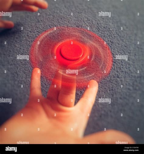 Boy Playing With A Fidget Spinner Toy Stock Photo Alamy