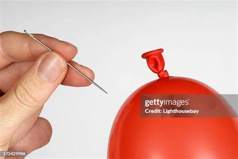 Needle Popping Balloon Photos and Premium High Res Pictures - Getty Images