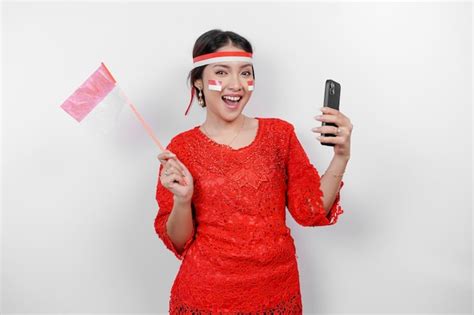 Premium Photo A Happy Asian Woman Wearing Red Kebaya And Headband