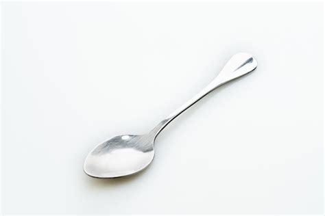 Premium Photo Silver Spoon On White Background