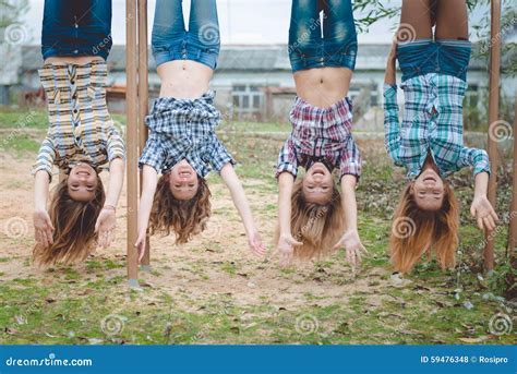 Four Young Funny Teenage Girls Hanging Upside Down Stock Photo Image