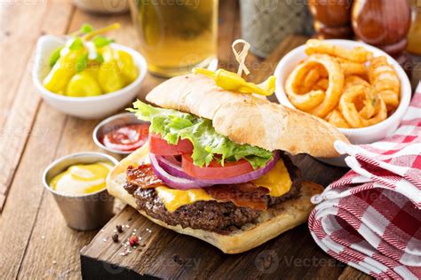 Traditional american burger with cheese and bacon 15749453 Stock Photo at Vecteezy