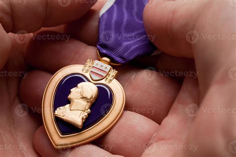 Man Holding Purple Heart War Medal 16299352 Stock Photo At Vecteezy