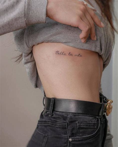 Bella La Vita Lettering Tattoo Located On The Rib Rib Tattoos For