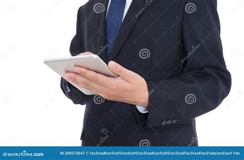 Man In Formal Wear Holding Tablet In Hand And Standing In Front Of