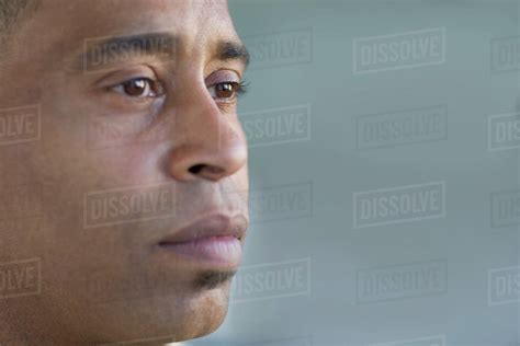 Close Of Up African Man Looking Pensive Stock Photo Dissolve