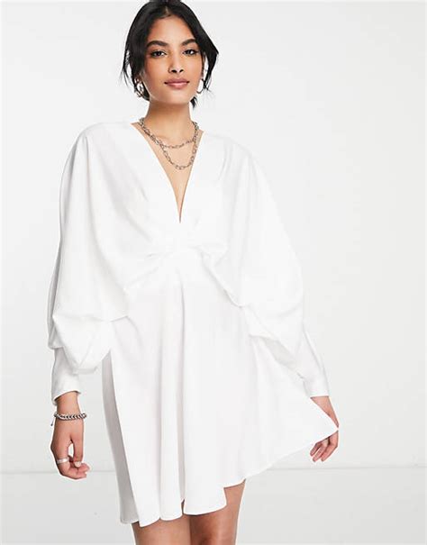 Asos Design Batwing Satin Mini Dress With Bias Cut Skirt And Tie Back In Ivory Asos