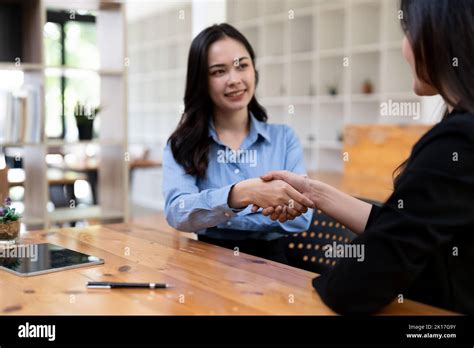 Portrait Young Asian Woman Interviewer And Adviser Shaking Hands For A