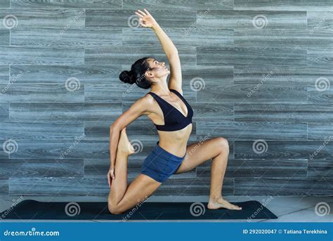 Crescent Moon Pose Variation Or Anjaneyasana Yoga With Ukrainian Woman