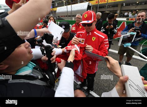 Finnish F Driver Kimi Raikkonen Of Ferrari Signs Autographs For Fans