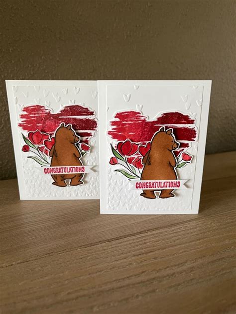 Two Cards With The Words Congratulations On Them One Has A Bear