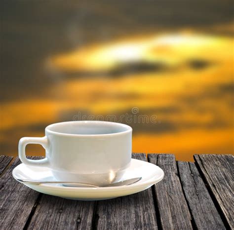 Coffee Cup On The Wooden Table Stock Photo - Image of wooden, sunset ...