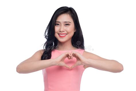 Pretty Romantic Young Asian Woman Making A Heart Gesture With He Stock