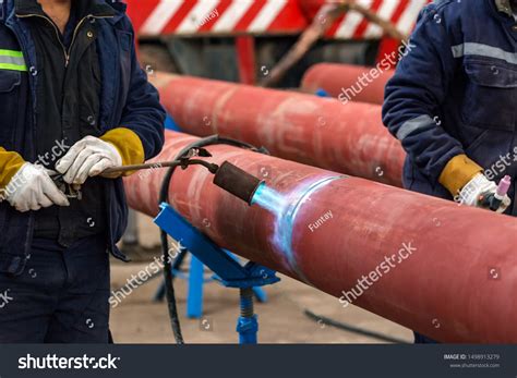 Welder Preheating Pipeline Before Welding Phenomenon Stock Photo