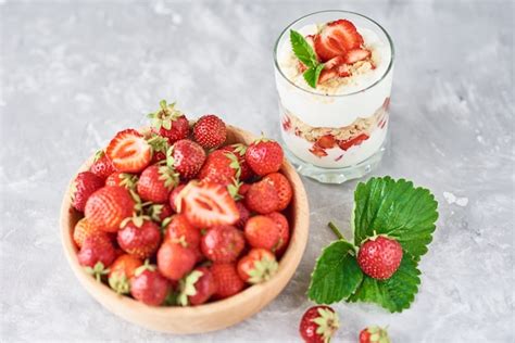 Premium Photo Strawberry Granola Or Smoothie In Glass And Fresh