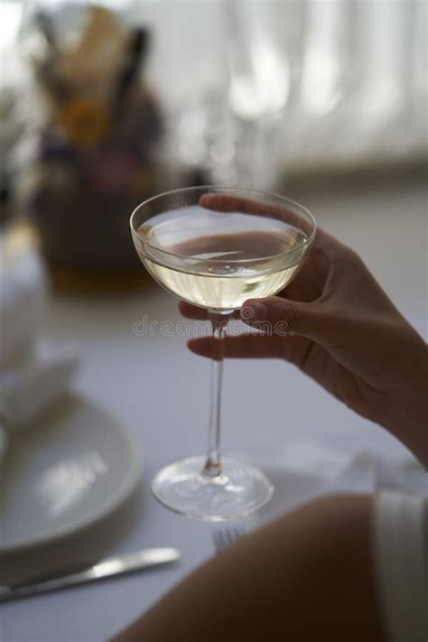 Woman Hand Holding Glass With Martini Cocktail Close Up Stock Image