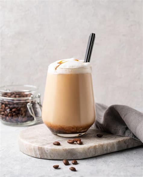 Premium Photo Cappuccino Or Latte With Milk Foam And Caramel In A