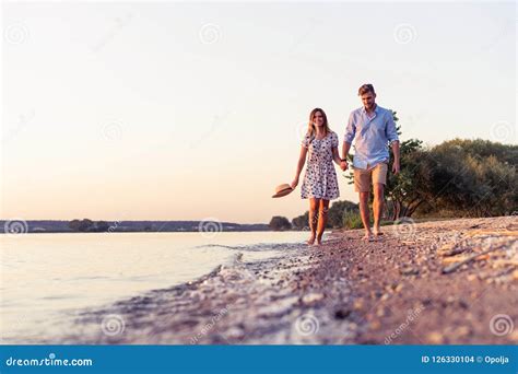 Couple Walking On The Beach At Sunset Stock Photo Image Of Love