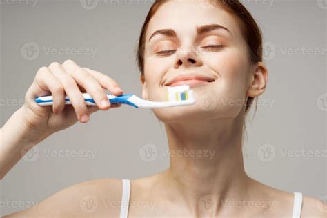 Woman In White T Shirt Cleans Teeth Hygiene Lifestyle 22261346 Stock