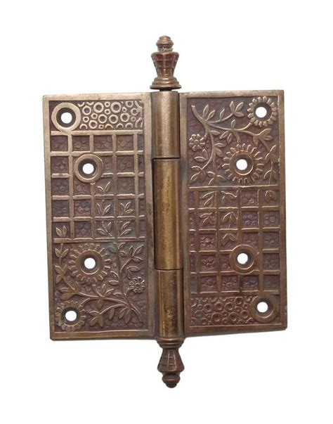 an antique brass door hinge with decorative designs on the front and ...