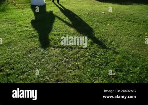 Lovely Couple Shadow People Walking Outdoors In Summer Day Silhouette