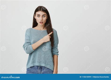 Studio Portrait Of Attractive Caucasian Student Showing Surprise And