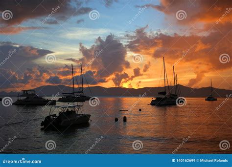 Boats Silhouetted By The Sunset In The British Virgin Islands Stock