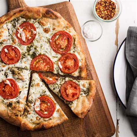 Pizza With Pesto Fresh Tomatoes And Mozzarella Recipe Epicurious