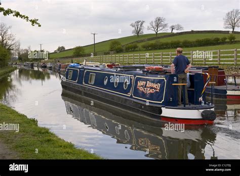 A Canal Boat Sailing On The Leeds Liverpool Canal Near Skipton North