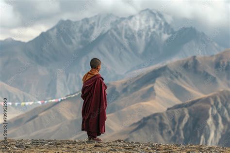 A 12 Year Old Tibetan Monk Adorned In Traditional Maroon And